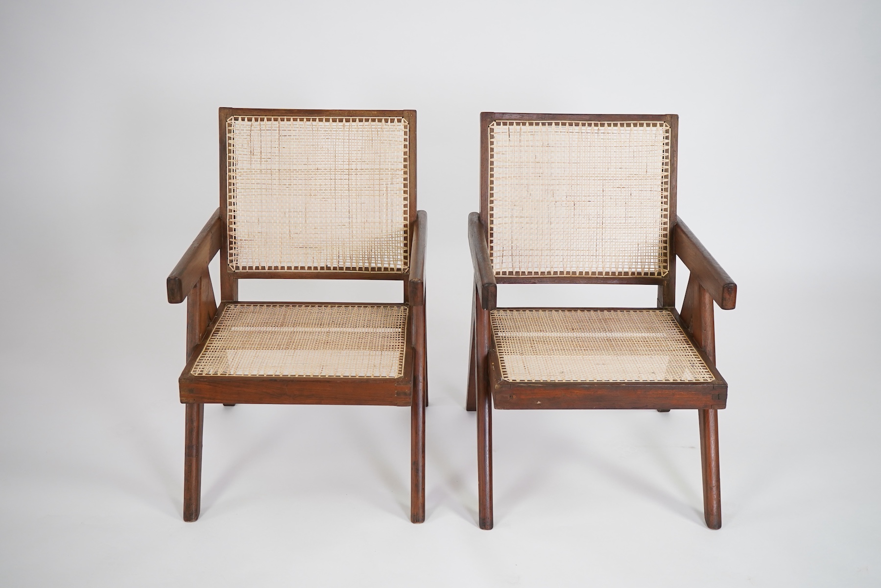 Pierre Jeanneret (Swiss, 1896-1967) for Chandigarh: A pair of cashew 'Easy' armchairs PJ-010105A